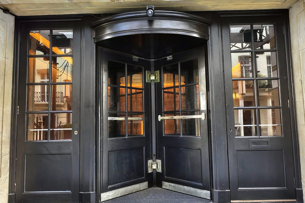 The black lacquered entrance doors at 30 Upper Grosvenor Street