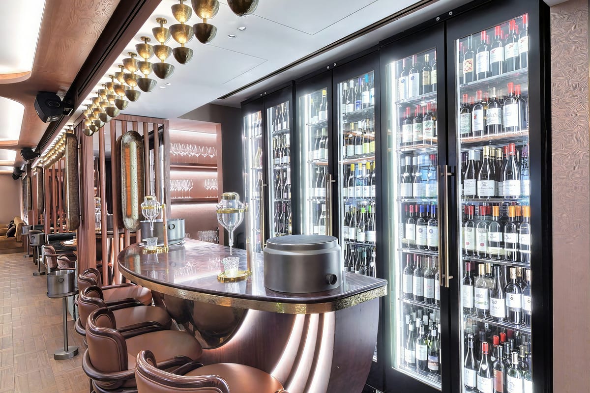 The sake bar with its marble counter and floor-to-ceiling cellar cabinets