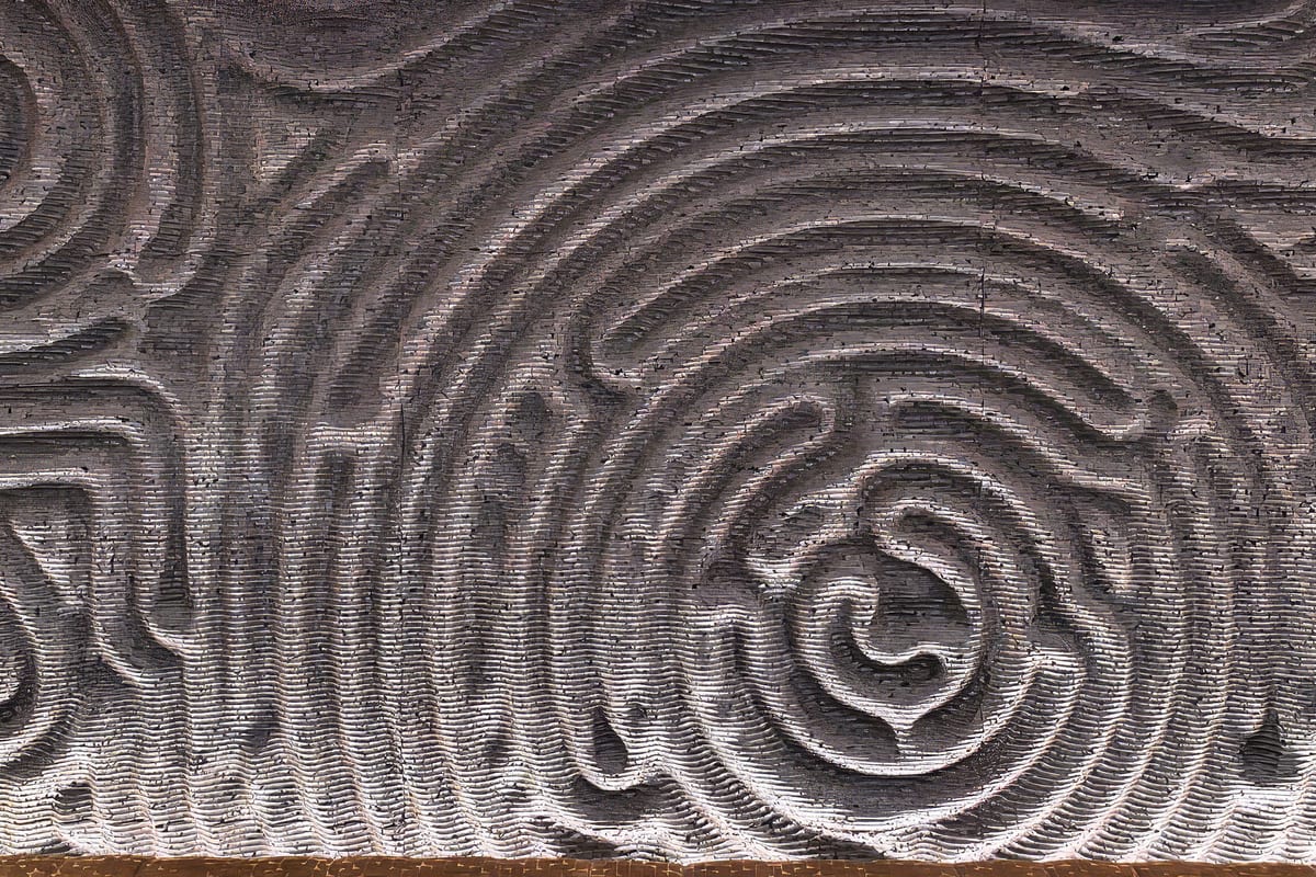 The hand-carved wave relief that runs the length of the dining room